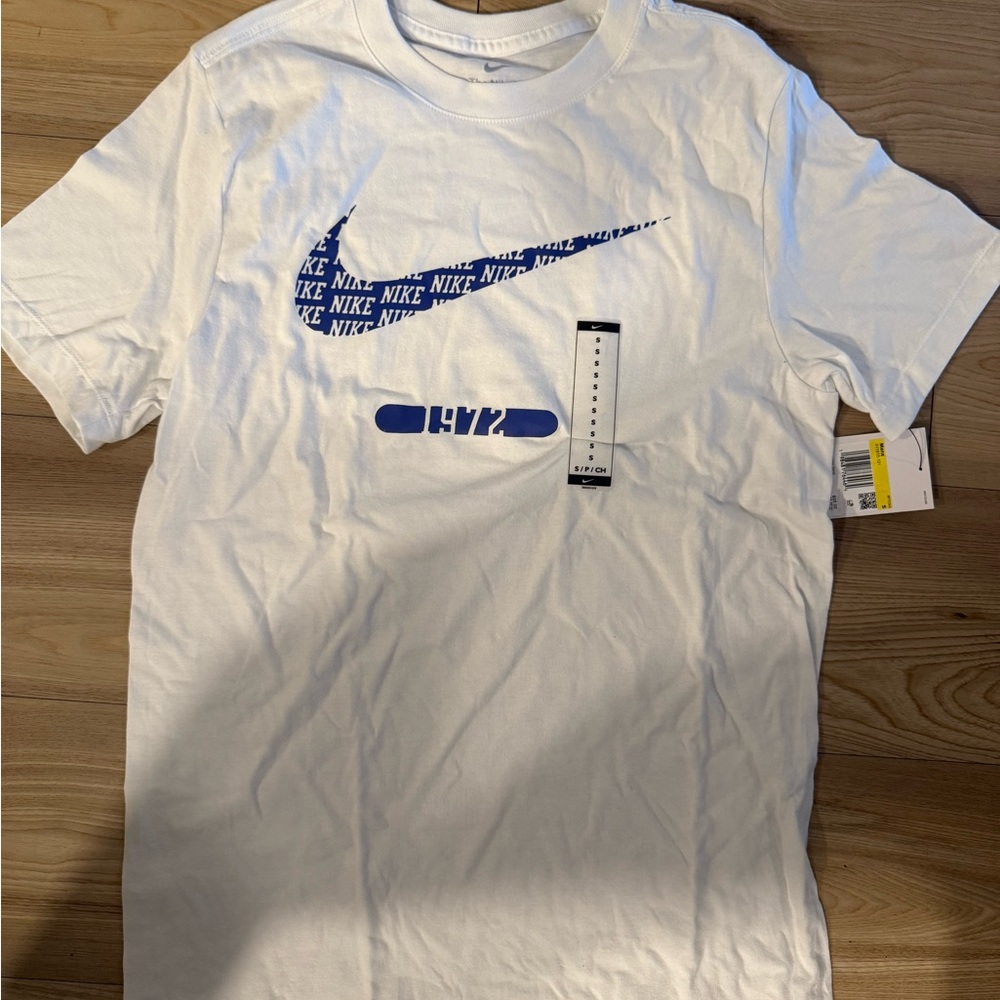 Nike White Tee with Blue Swoosh Design